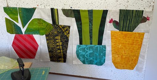 quilt blocks that look like planters and the bottoms of plants.